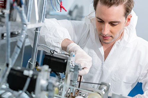 A man working in a lab setting.